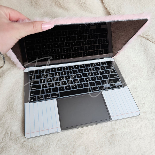 A Macbook in a ultra fluffy laptop cover by Fleece Chic.