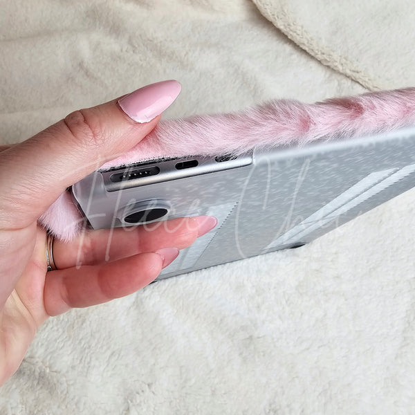 A side view of a MacBook in a laptop cover that is ultra plush by Fleece Chic.