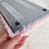 A bottom view of a MacBook in a laptop cover that is ultra plush by Fleece Chic.