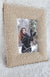 A stylish picture frame in the color Oatmeal by Fleece Chic with the image of a woman in snow framed.