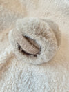 A close up detail shot of fur earmuffs by Fleece Chic.