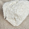 A close-up of the plush on a sherpa bag that has a flower lining - Fleece Chic