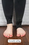 Black fleece lined tights in the stirrup style with a plush lining have their pant legs displayed in two different ways to show their versatile styling - Fleece Chic