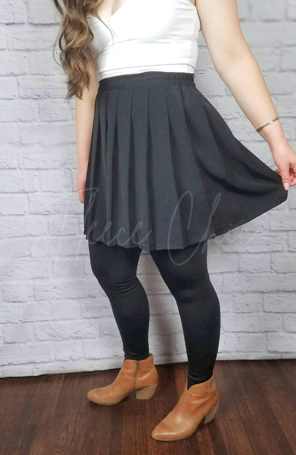 Opaque fleece lined tights in the stirrup style are worn with a twirl skirt by Fleece Chic