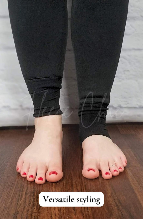 Black fleece lined tights in the stirrup style with a plush lining have their pant legs displayed in two different ways to show their versatile styling - Fleece Chic
