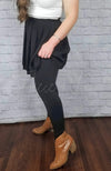 Stirrup tights that are opaque with fleece lining are worn with a black twirl skirt - Fleece Chic