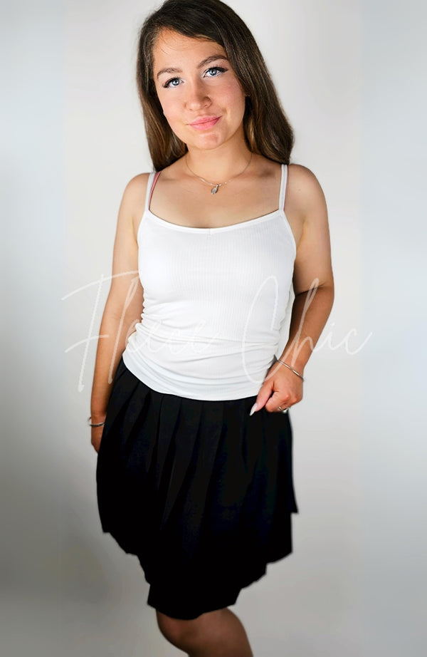 A woman wears a Thermal Tank paired with a Twirl Skirt - Fleece Chic