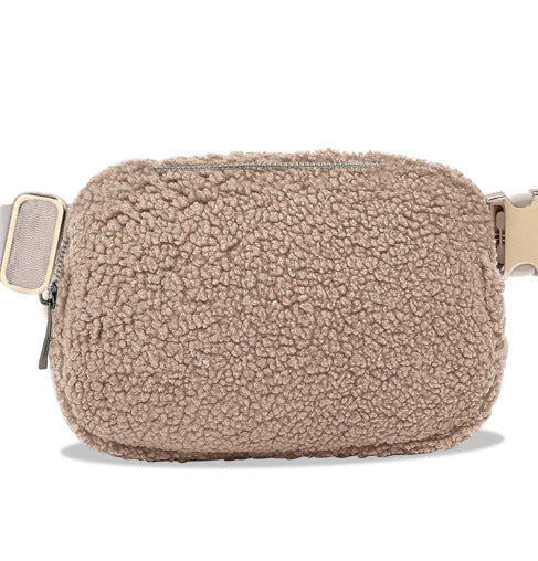 A light brown teddy hip bag with gold clasp by Fleece Chic.