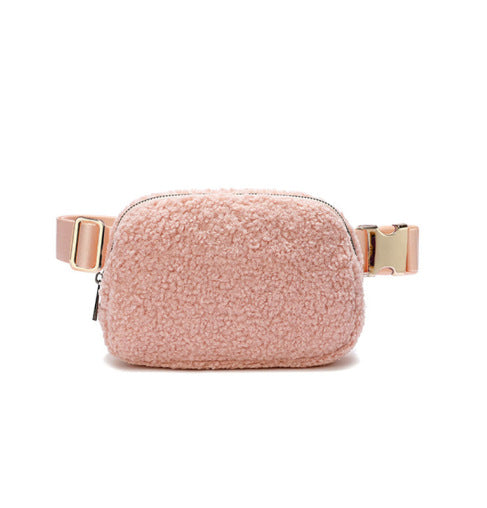 A pink teddy hip bag with gold clasp by Fleece Chic.