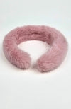 A closeup of a fur headband that is dusty pink by Fleece Chic.