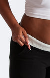 A pair of cozy leggings with pockets have their plush lining displayed - Fleece Chic