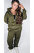 Olive green fleece sweatpants and a fleece sweatshirt are worn by a model as a set.