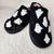 Fuzzy slippers with cute ghost motifs by Fleece Chic.