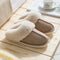 Plush slippers that're khaki with a fuax fur collar and warm lining are displayed - Fleece Chic