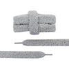 Close-up detail of a pair of unique shoelaces that are gray and fuzzy - Fleece Chic