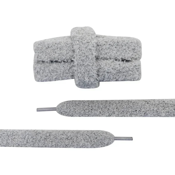 Close-up detail of a pair of unique shoelaces that are gray and fuzzy - Fleece Chic