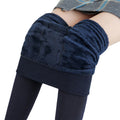 Navy opaque tights with a fleece lining are worn by a woman in a gray and blue striped skirt - Fleece Chic
