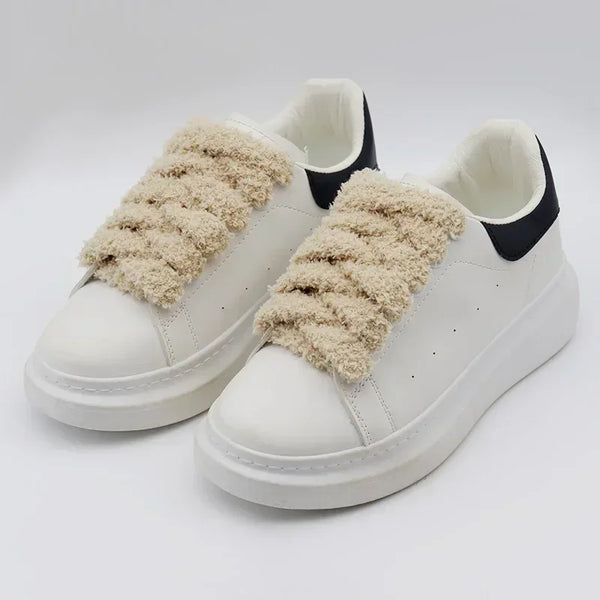 White sneakers with black backs and unique shoelaces that are fluffy and beige - Fleece Chic