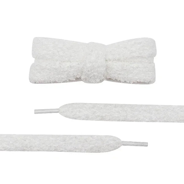 Close-up detail of a pair of unique shoelaces that are white and fuzzy - Fleece Chic