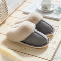 Fur slippers that're light gray with a plush lining are displayed - Fleece Chic