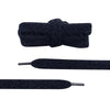 Close-up detail of a pair of wide shoelaces that are fluffy and black by Fleece Chic.