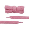 Close-up detail of a pair of unique shoelaces that are pink and fuzzy - Fleece Chic