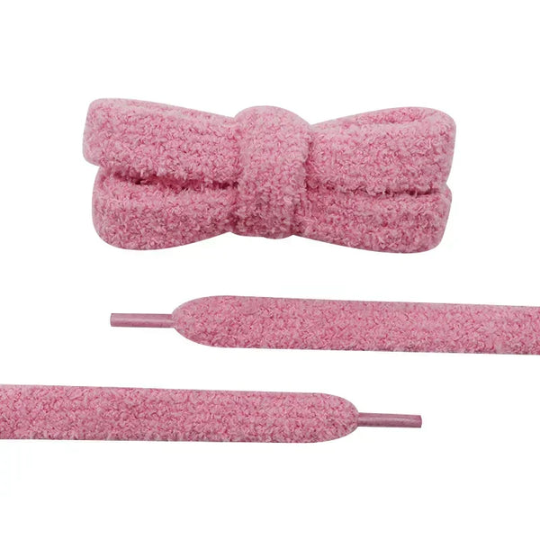 Close-up detail of a pair of unique shoelaces that are pink and fuzzy - Fleece Chic