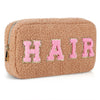 Light brown chenille bag by Fleece Chic with letters spelling out the word "hair."