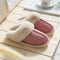 Faux fur slippers that're pink with a plush lining are displayed - Fleece Chic