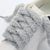 A close-up of unique shoelaces that are fluffy, perfect for cold-weather fashion - Fleece Chic
