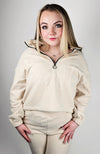 A matching set of beige colored sweats clothing is worn by a woman with blonde hair - Fleece Chic