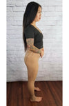 Plush tights that are tan are worn by an Asian woman in a black crop top who is posing showing her side profile - Fleece Chic