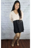 Plush tights that are tan are worn by an Asian woman in a sweater crop top and cute black skirt - Fleece Chic