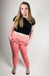 Fleece Joggers that are Peachy Blush colored are worn by a model with blonde hair - Fleece Chic