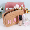 Teddy pouches for makeup or toiletries with chenille patches are displayed with cosmetics - Fleece Chic