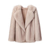 A fox fur coat is shown with a white background - Fleece Chic