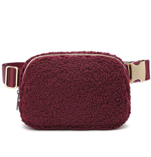 A burgundy teddy hip bag with gold clasp by Fleece Chic.