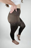 A woman wears brown yoga leggings that have a fleece lining - Fleece Chic