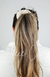 A woman wears her hair in a ponytail with a Fuzzy Scrunchie - Fleece Chic