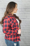 Insulated flannel shirt with sherpa lining is worn by a woman with long brown hair - Fleece Chic