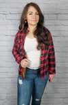 Insulated flannel shirt with sherpa lining in red and blue plaid is worn by a woman in jeans and brown booties - Fleece Chic