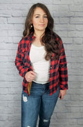 fuzzy flannel with fleece lining in red and blue plaid is worn by a woman in jeans and brown booties - Fleece Chic