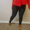 Plush leggings with a fuzzy lining are worn by a woman in a red sweater and leather booties - Fleece Chic