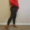 Plush leggings in black are worn by a woman in a red sweater and leather booties - Fleece Chic