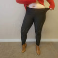 Plus size fleece lined leggings have their strechiness displayed - Fleece Chic