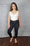 Stirrup tights that are opaque with fleece lining are worn with a white crop top - Fleece Chic