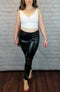 Thermal Leather Leggings are worn by a woman in a white crop top - Fleece Chic