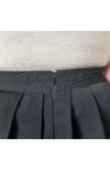 A twirl skirt has its back zipper displayed - Fleece Chic