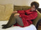 Plus size fleece lined tights fake translucent are worn by a larger african american woman in a red velvet dress who is smiling while lying on a couch - Fleece Chic