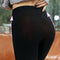Plush leggings with a fleece lining are displayed from the rear to show how they flatter your curves from behind - Fleece Chic